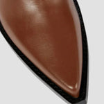Brown boot toe with leather-look texture and black-edged sole