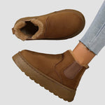 Brown winter ankle boots with fur lining and elastic side panels
