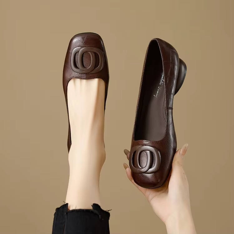 Brown soft leather ballet flats with circular buckle detail and low sole
