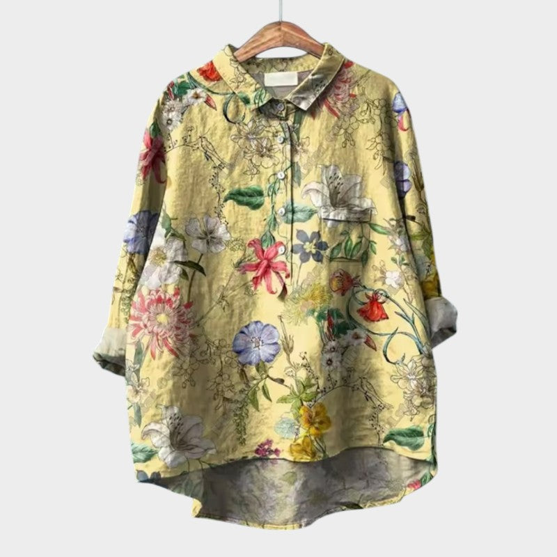 Premium floral-print button-up blouse with collar, long sleeves, and patch pockets