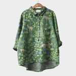 Green floral button-up blouse with long sleeves and chest pocket