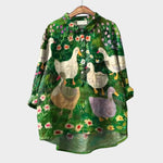 Green blouse with allover bird and flower print, long sleeves