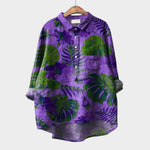 Tropical-print button-up blouse with front pocket, long sleeves and collar