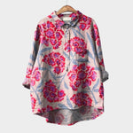 Floral print button-up blouse with collar, chest pocket, and long sleeves
