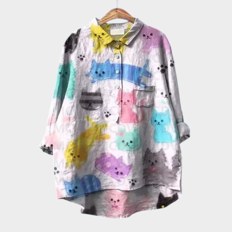 Long-sleeve button-up blouse with colorful animal print, collar, patch pockets