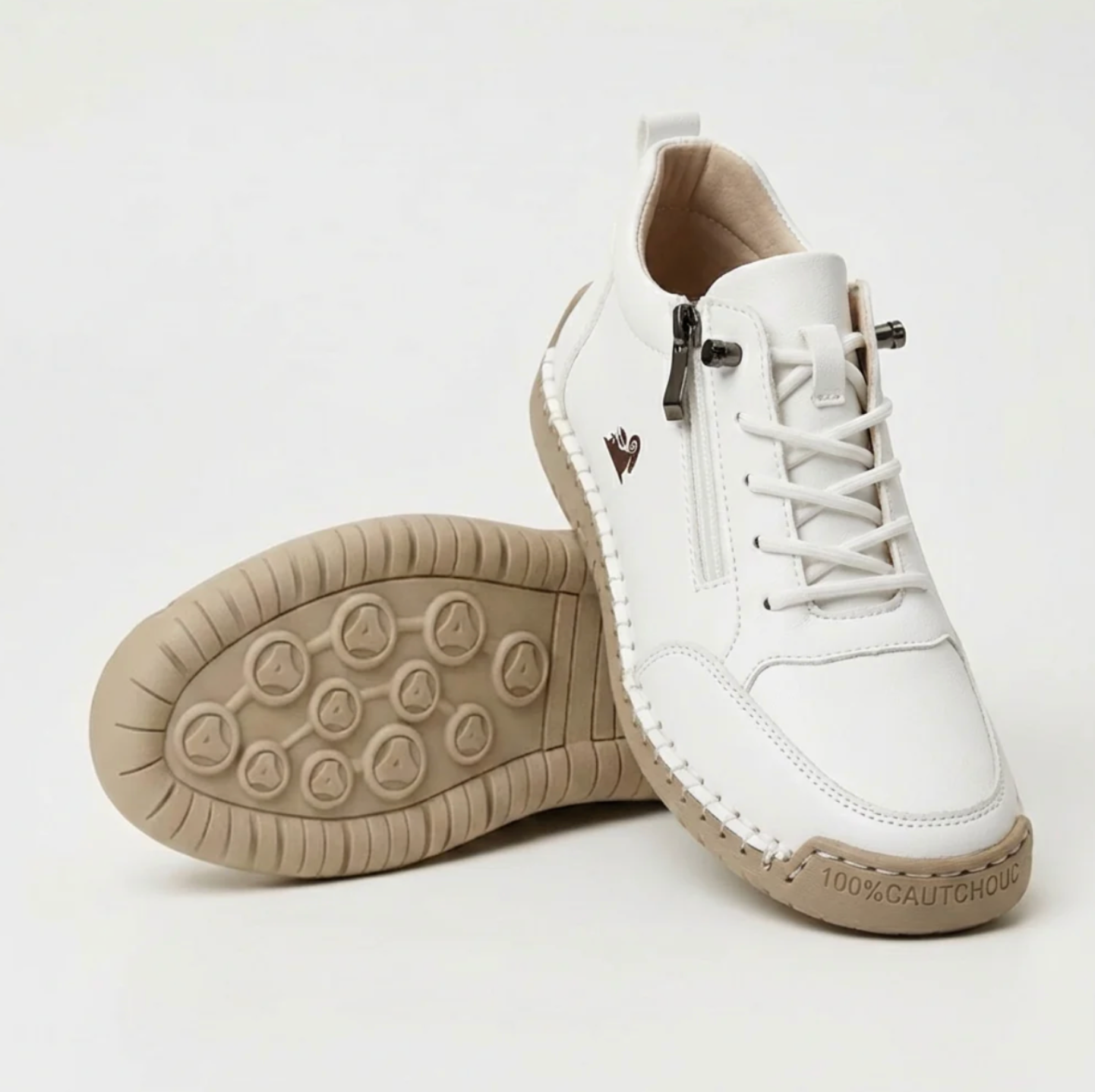 White sport orthopedic sneaker with lace-up, side zipper, and grippy beige outsole.
