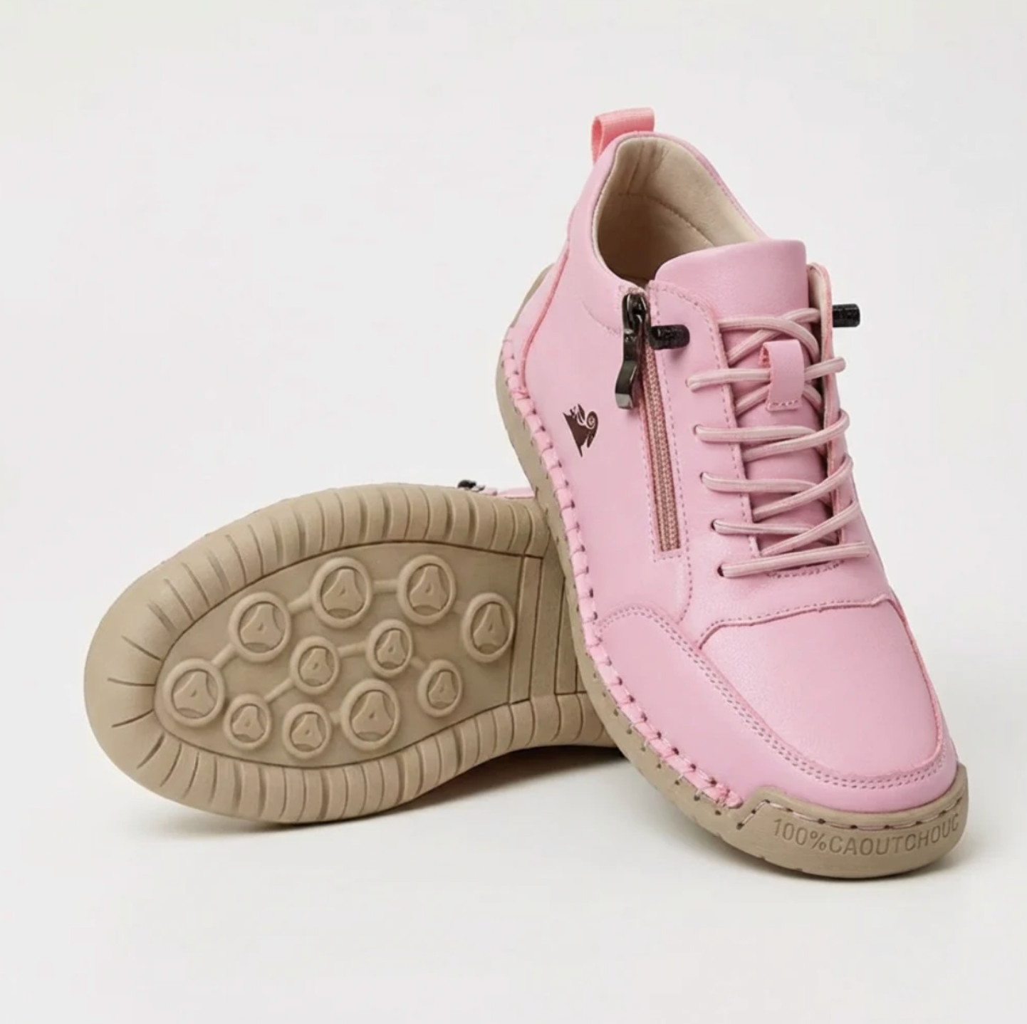 Pink sport orthopedic sneaker with lace-up, side zipper, and beige cushioned sole.