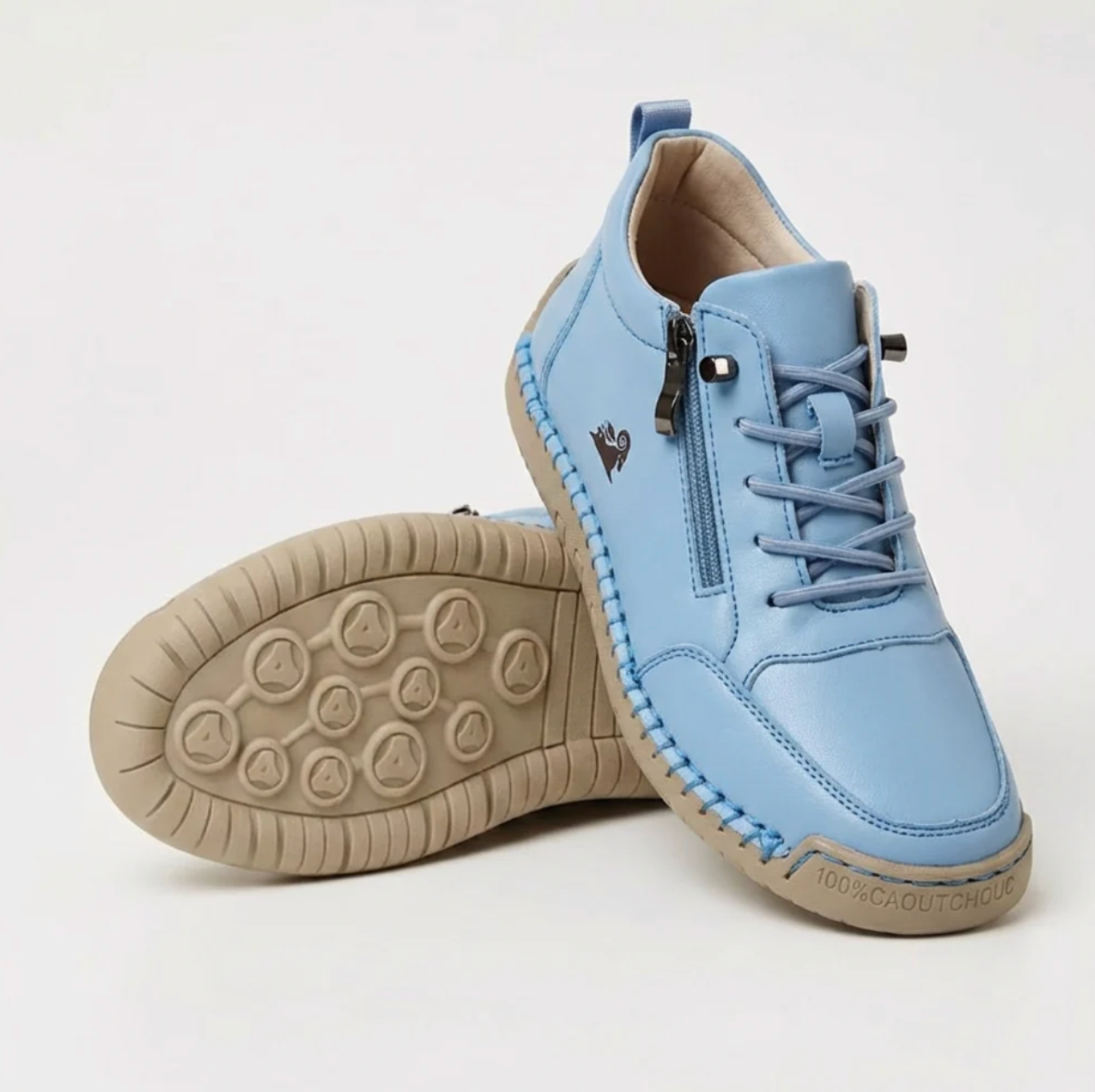 Light blue sport orthopedic sneaker with lace-up, side zipper, and grippy beige sole.