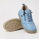 Light blue sport orthopedic sneaker with lace-up, side zipper, and grippy beige sole.