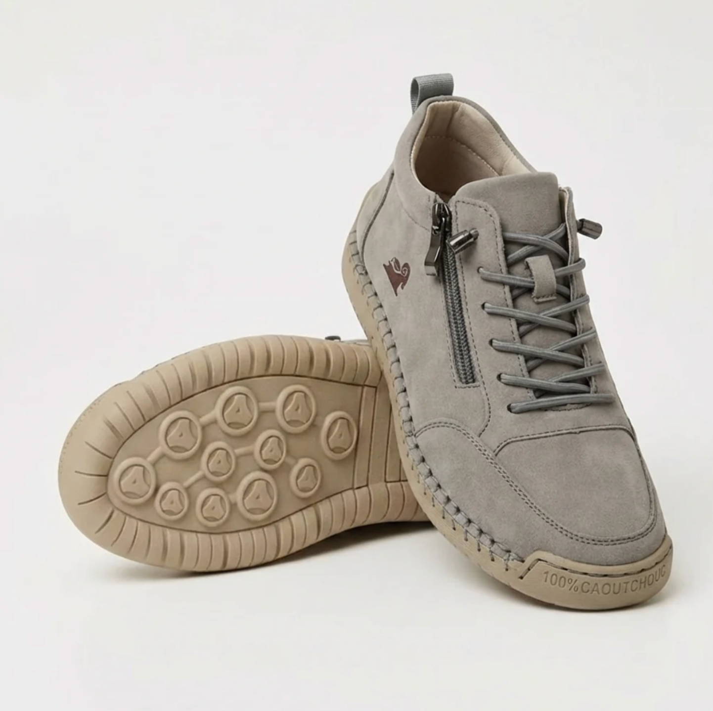 Gray sport orthopedic sneaker with lace-up, side zipper, and grippy beige outsole.
