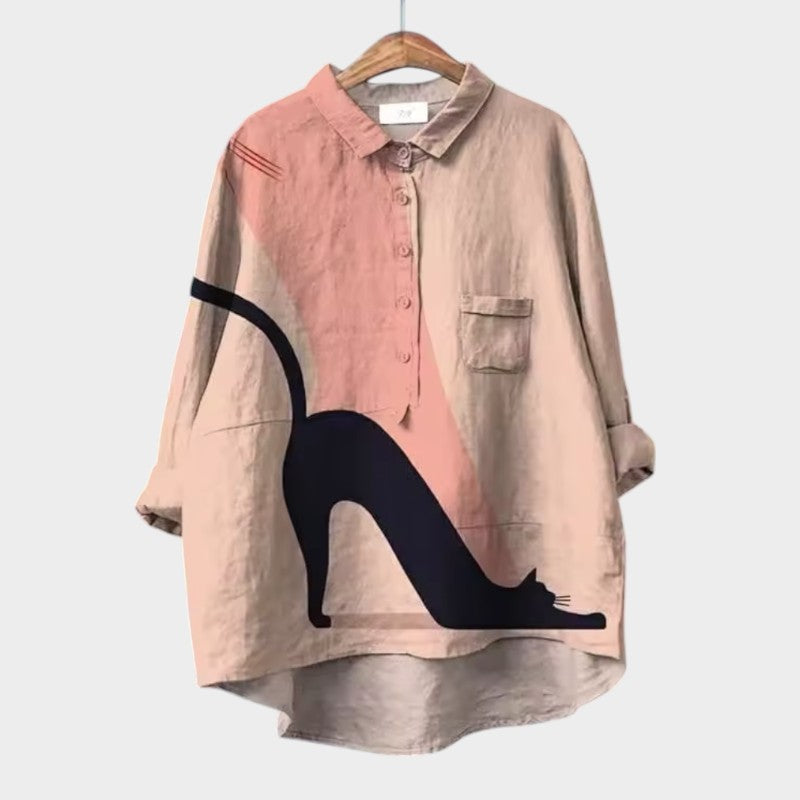 Beige oversized button-up blouse with abstract cat print and chest pocket