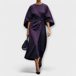 Violet satin midi dress with wide batwing sleeves and waist tie, side draped detail.