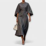 Gray satin midi dress with wide batwing sleeves and waist belt, soft gathered panel.