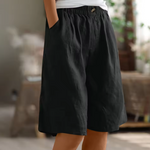 Cotton casual shorts with elastic waist, dark color, button detail, loose fit