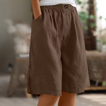 Cotton casual shorts with elastic waist, brown color, button detail, loose fit