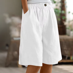 Cotton casual shorts with elastic waist, white color, button detail, loose fit