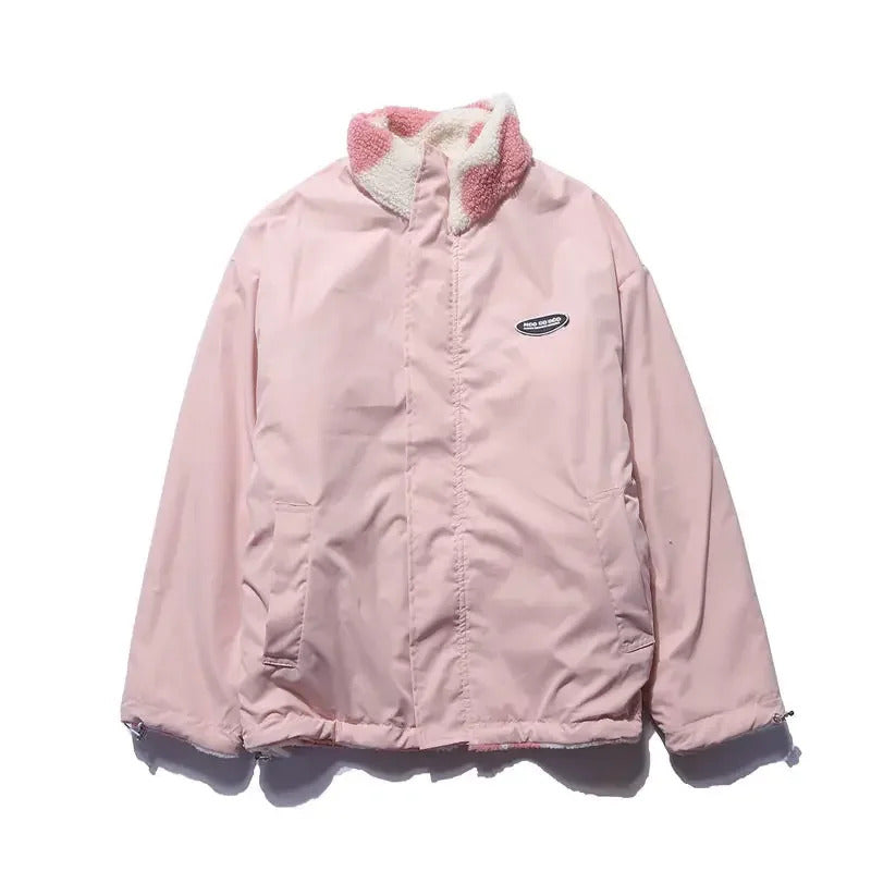 Light pink reversible winter jacket, smooth outer shell with front zip and pocket seams