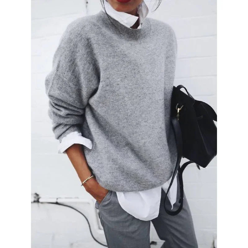 Light gray crewneck pullover sweater with long sleeves, loose fit