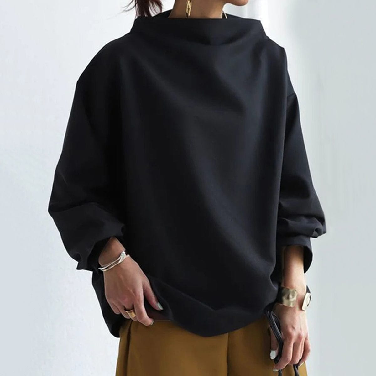 Black high-neck pullover sweater with long sleeves and loose silhouette
