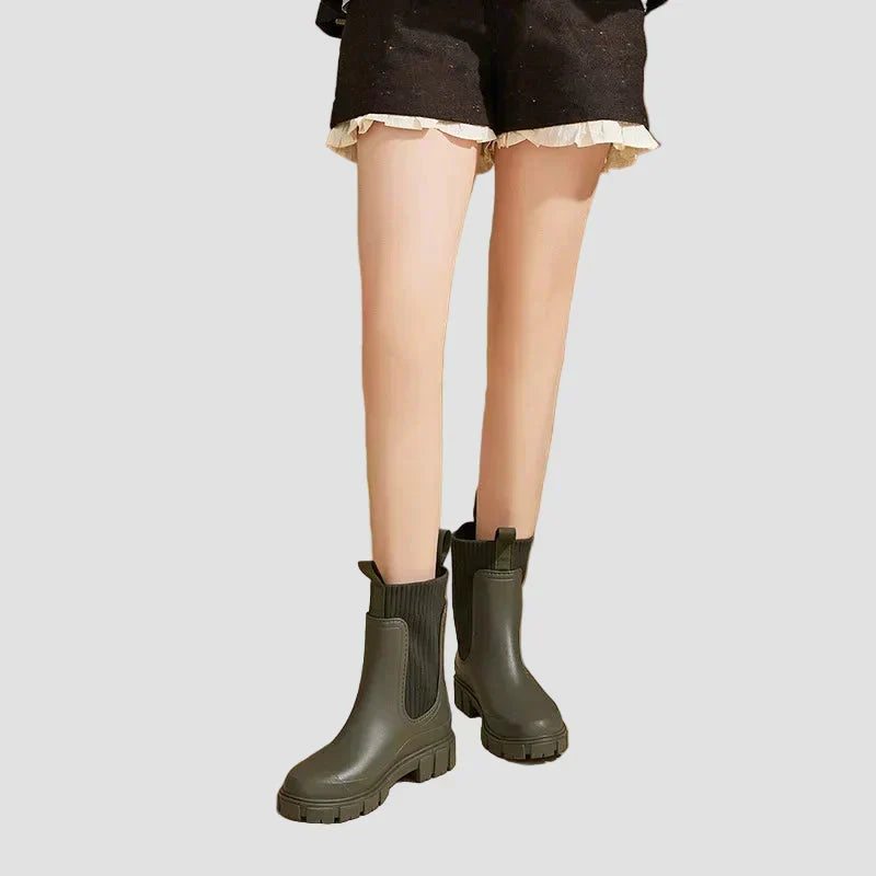 Waterproof dark olive Chelsea boots with elastic side panels and chunky tread sole