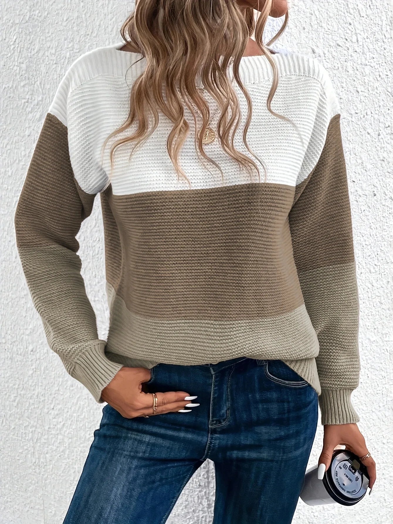 Color-block knit sweater, crew neck, long sleeves; white, tan-beige, and brown panels.