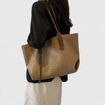 Khaki-gold woven tote bag with two top handles and zip closure