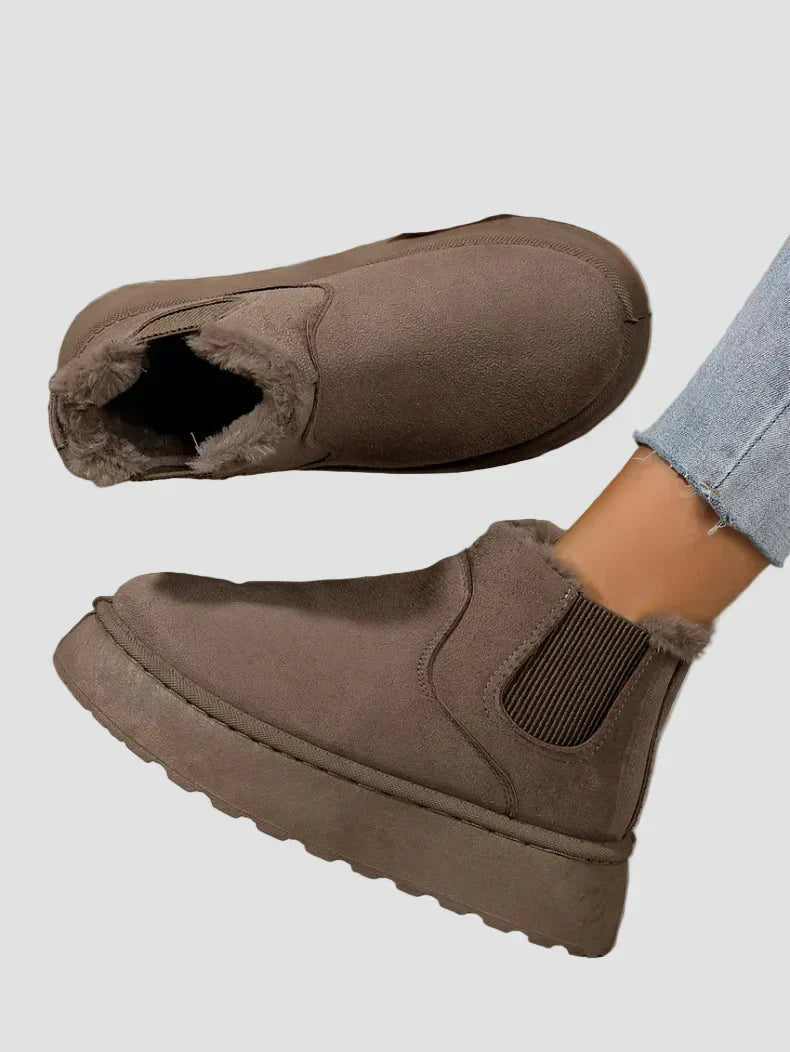 Dark brown winter ankle boots with fur lining and elastic side panels
