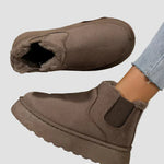 Dark brown winter ankle boots with fur lining and elastic side panels