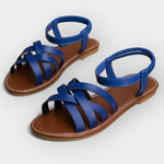 Handmade blue flat sandals with wide toe straps and ankle strap