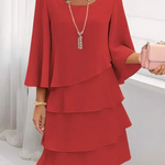 Beige layered ruffle shift dress with draped scoop neckline and tiered skirt