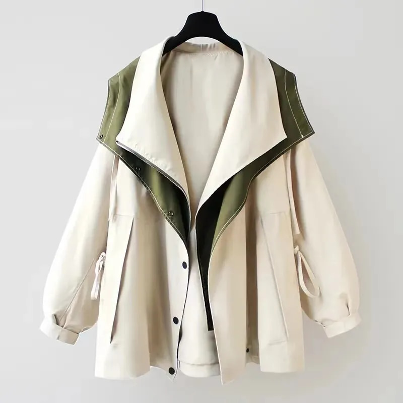 Two-tone parka jacket on hanger, light cream with olive green sleeves and hood