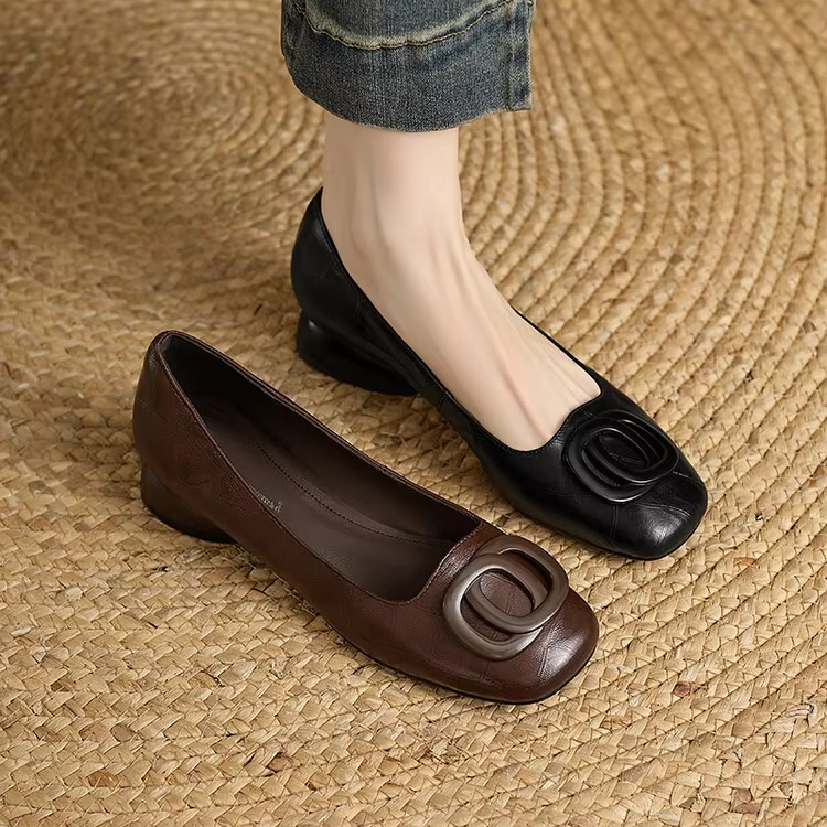 Pair of ballet flats: black and dark brown soft leather with circular buckle detail