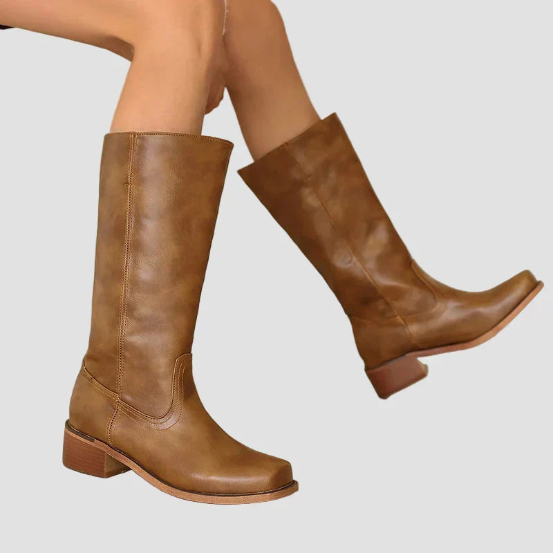 Brown tall pull-on equestrian boots with block heel and side seam details