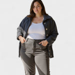 Navy-blue fleece jacket with button-front closure and flap chest pockets, long sleeves