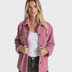 Rose/pink fleece jacket with button closure and two chest pockets, long sleeves