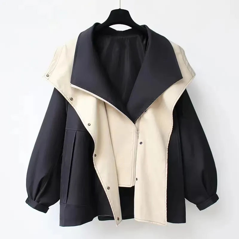 Two-tone hooded parka jacket on hanger, dark navy with light cream front panel