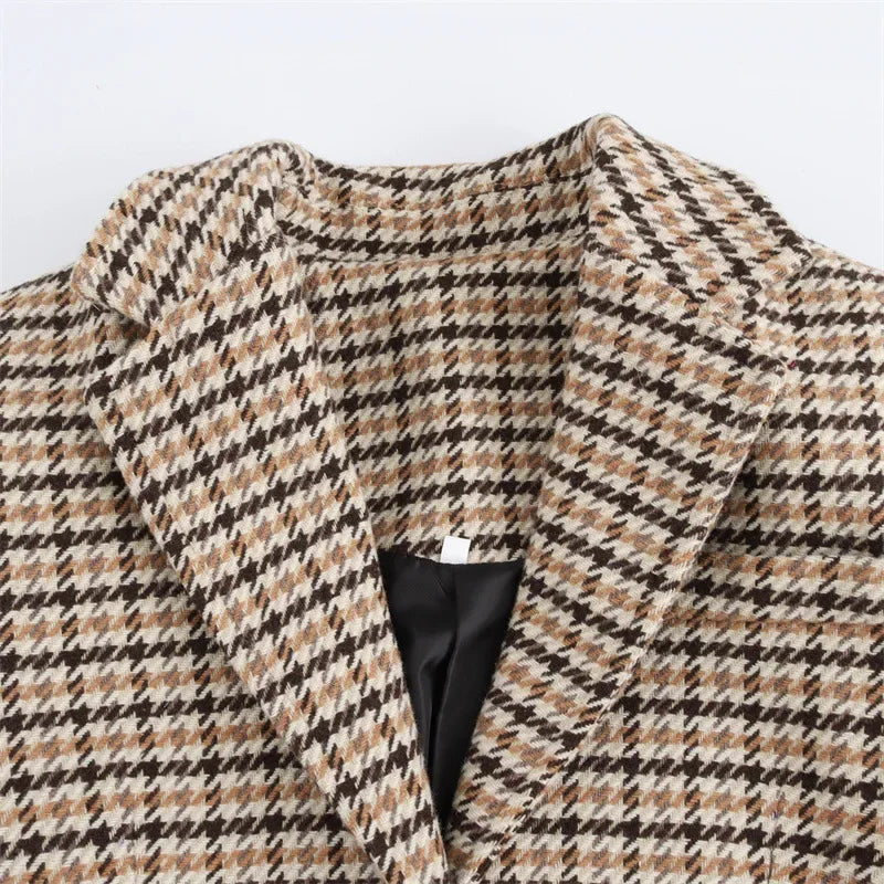 Plaid coat neckline detail with notched collar and buttoned placket