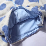 Open reversible jacket showing light blue inner lining and heart fleece