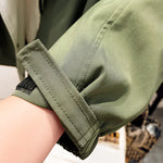Modern jacket cuff strap, sage green with reinforced stitching and button closure