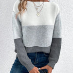 Color-block knit sweater, crew neck, long sleeves; light gray and darker gray panels.