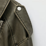 Élodie™ trendy jacket in dark green faux leather with snap shoulder detail
