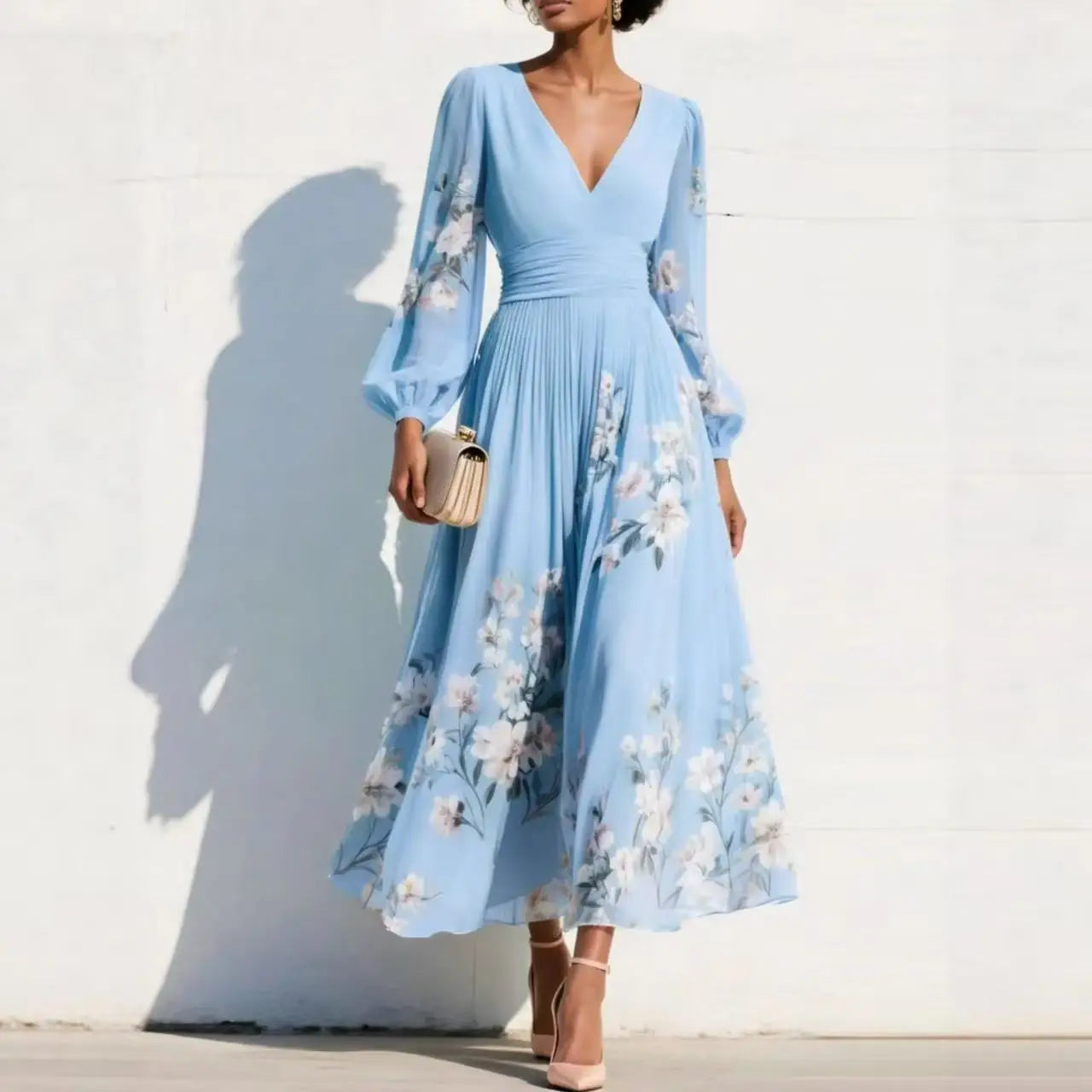 Light blue floral midi dress with V-neck, long sheer sleeves, and pleated skirt