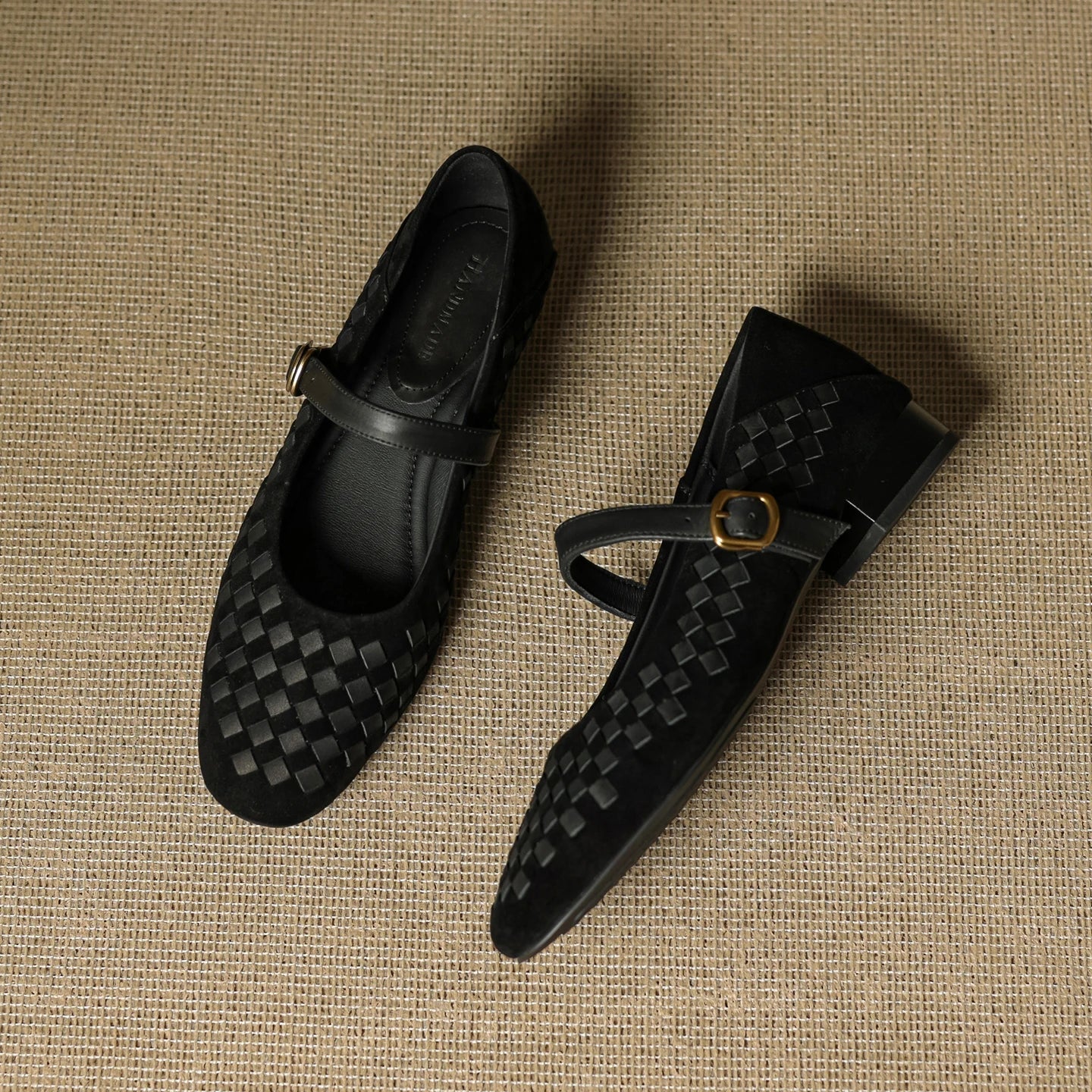 Black woven leather Mary Jane sandals with ankle strap and gold-tone buckle