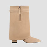 Tan tall boots with center zipper, cuff buckle strap, and block heel