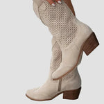 Light beige cowboy boots with perforated vamp and mid-height block heel