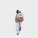 Brown leather-look hobo tote bag with top handles and side tie straps