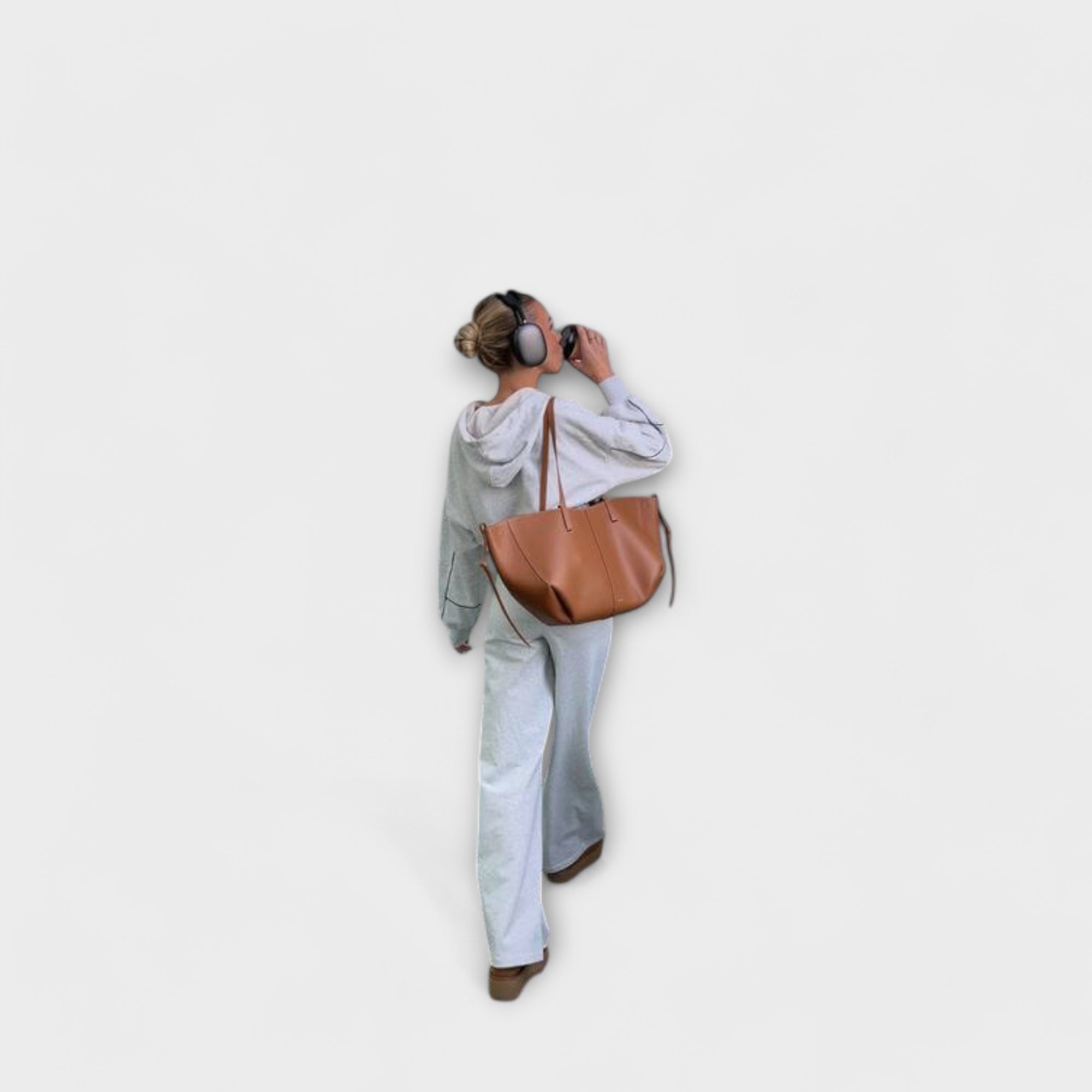 Brown leather-look hobo tote bag with top handles and side tie straps