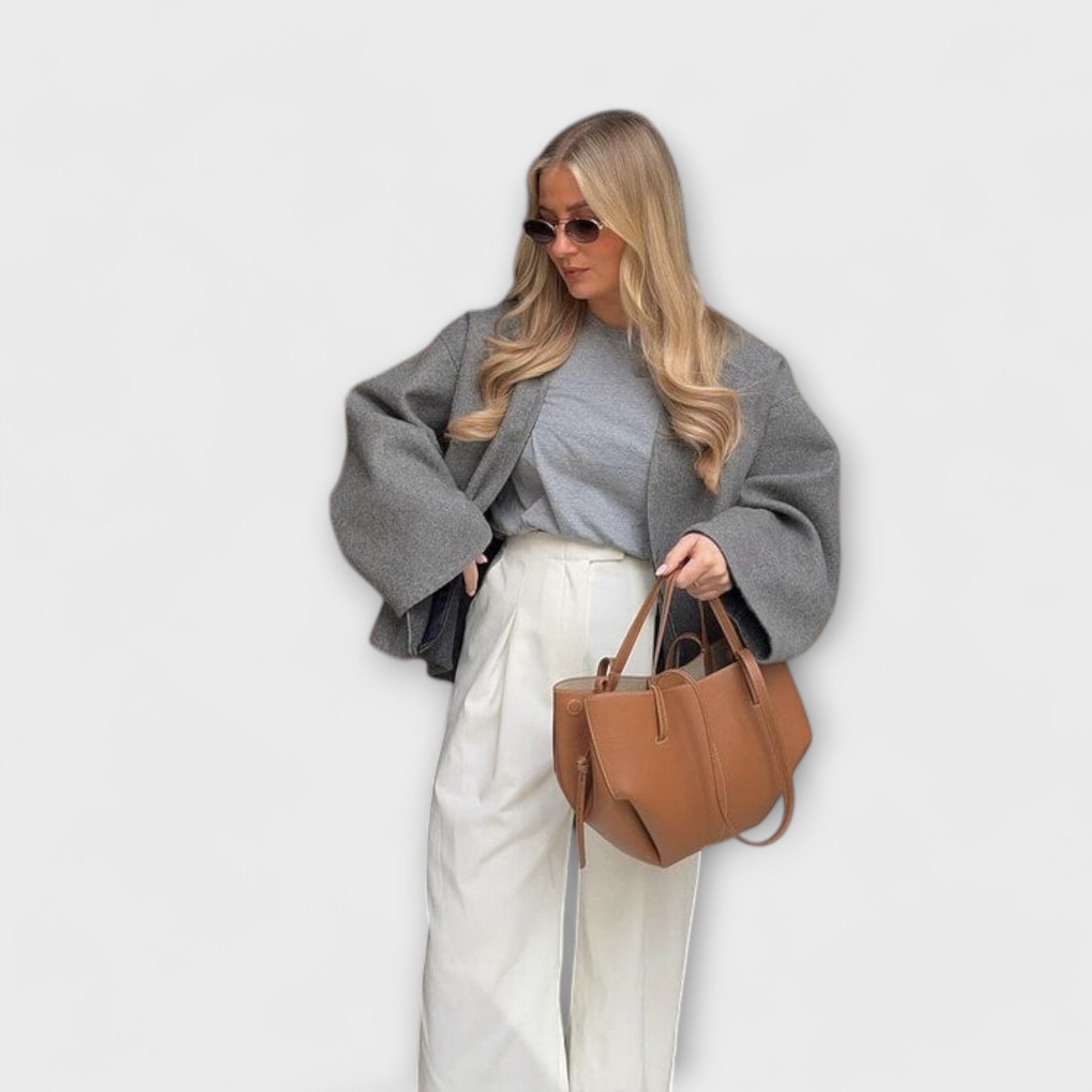 Brown leather-look hobo tote bag with curved top handles and structured sides