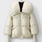 Off-white puffer jacket with faux fur collar, zip front, flap pockets.