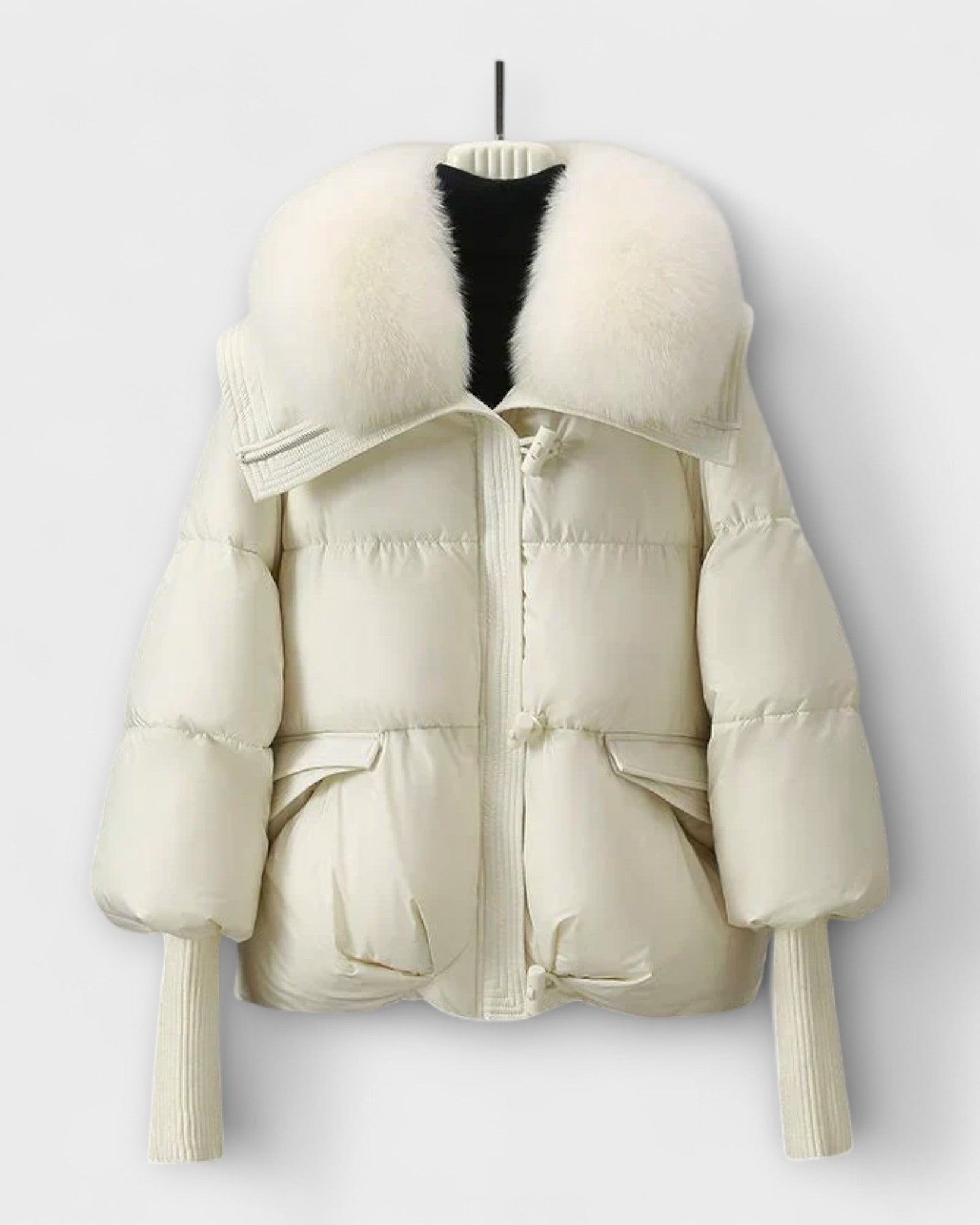 Off-white puffer jacket with faux fur collar, zip front, flap pockets.